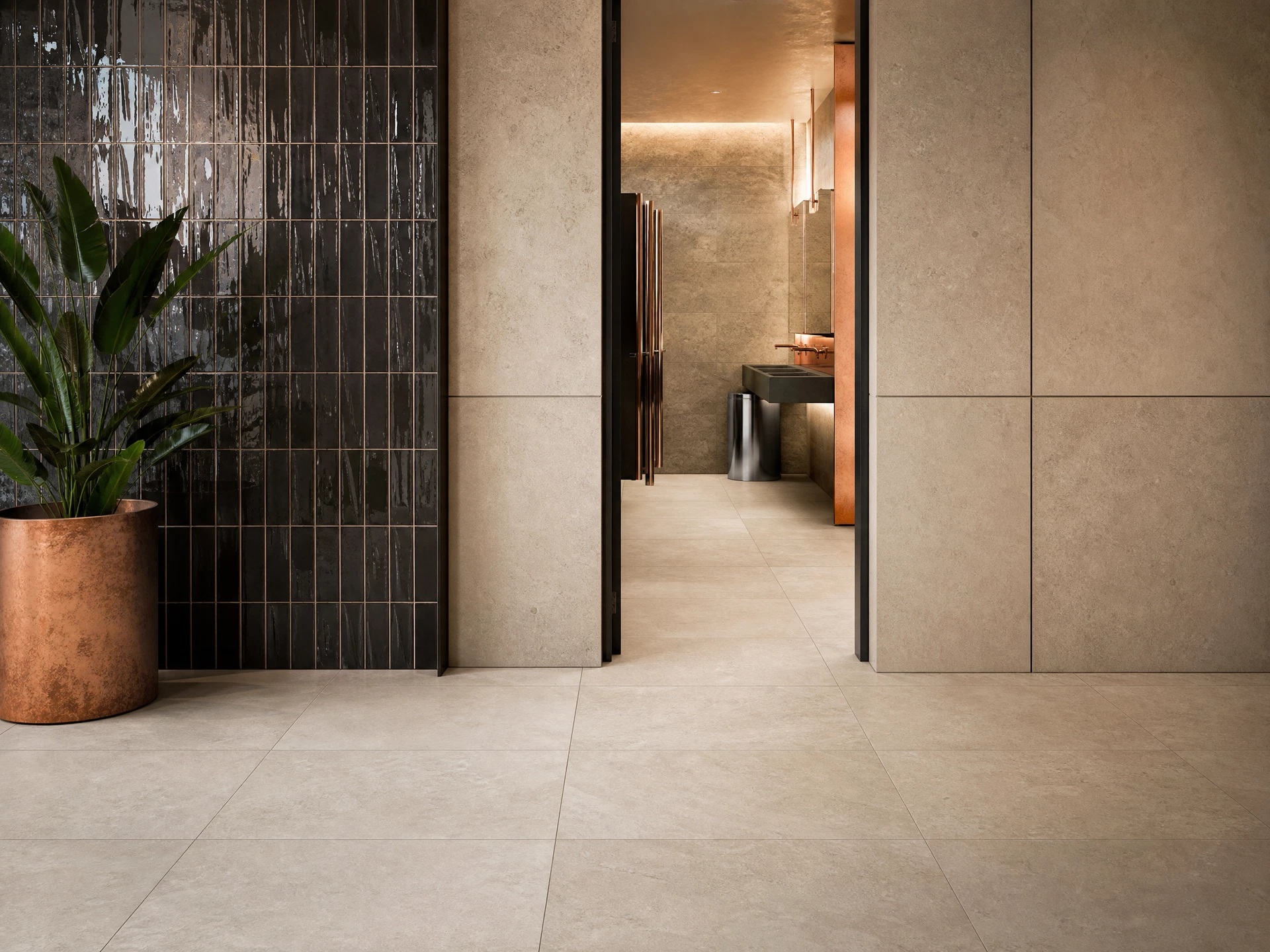 Large-format porcelain floor and ceramic wall tile in a commercial interior